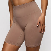 Load image into Gallery viewer, Brown high-waisted shorts worn by a person on a light gray background
