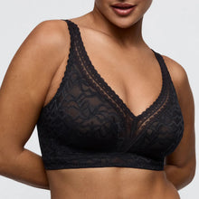 Load image into Gallery viewer, Black lace bra on a model against a neutral background
