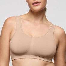 Load image into Gallery viewer, Beige bra worn by a model on a light gray background
