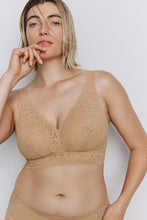 Load image into Gallery viewer, Woman wearing a beige lace bralette against a plain background
