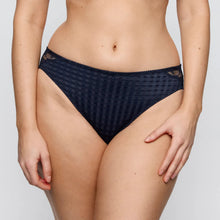 Load image into Gallery viewer, Navy blue patterned underwear worn by a person on a light gray background
