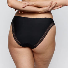 Load image into Gallery viewer, Black lace-trimmed underwear worn by a person on a plain background
