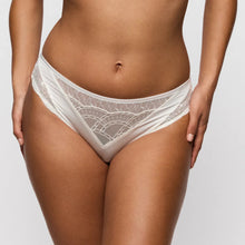 Load image into Gallery viewer, White lace underwear worn by a person on a plain background
