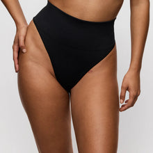 Load image into Gallery viewer, Person wearing black high-waisted bikini bottoms on a plain background
