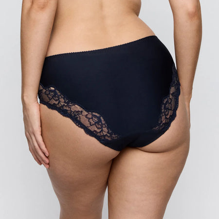 Navy blue lace-trimmed underwear on a neutral background