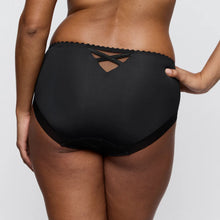 Load image into Gallery viewer, Black bikini bottom worn by a person on a plain background
