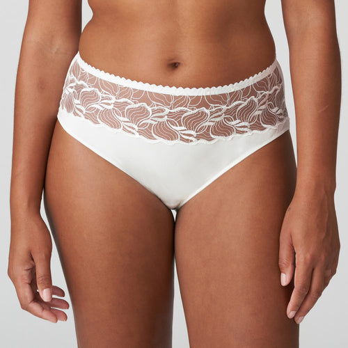 A sensual high-waisted briefs in a beautiful opaque fabric, width a wide band of sheer embroidery at the waistband. Ivory is a soft white shade that gently contrasts with the skin. Perfect under summer clothes or delightful as bridal lingerie. Fabric: Polyamide: 67%, Elastane:14%, Polyester:12%, Cotton: 7%