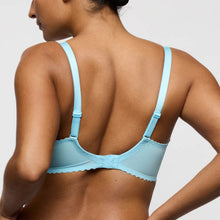 Load image into Gallery viewer, Light blue bra worn by a model on a plain background
