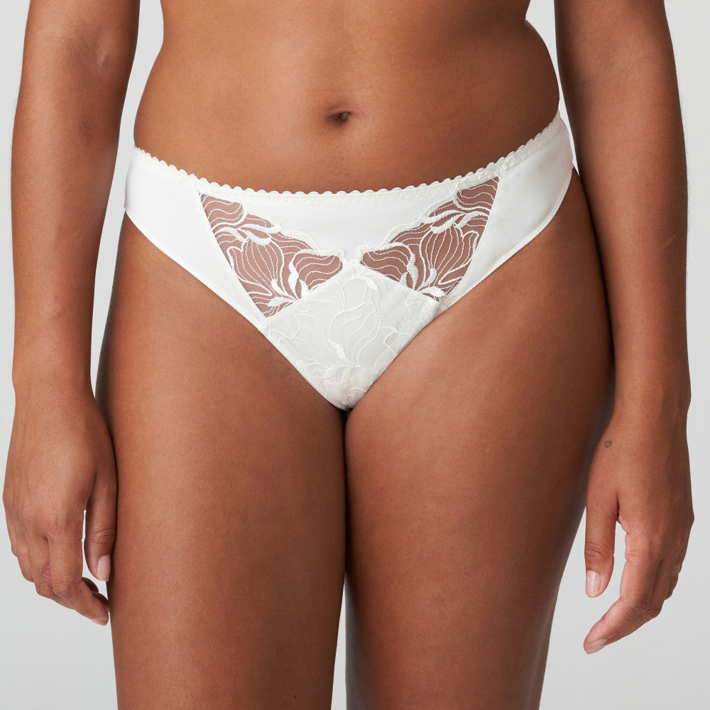Glamourous G/String in a beautiful opaque fabric. It has lovely sheer embroidery cutouts over the tummy. Ivory is a soft white shade that gently contrasts with the skin. Perfect under summer clothes or delightful as bridal lingerie. Fabric: Polyamide: 67%, Elastane:14%, Polyester:10%, Cotton: 9%