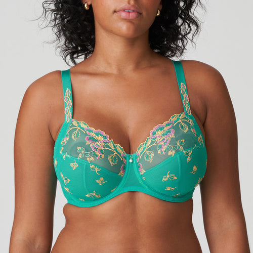 There is lovely guipure lace on the shoulder straps and a pearl at the centre-front. The embroidery elegantly runs all the way to the tops of the cups, seamlessly connecting the upper cups for beautiful cleavage. Sunny Teal is a tropical shade of green with ochre and fuchsia highlights. Looks great on both pale and dark skin. Fabric content: Polyamide: 54%, Polyester: 34%, Elastane: 12%