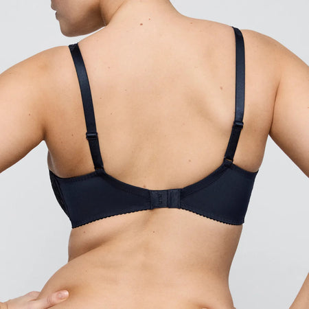 navy bra worn by a person on a plain background