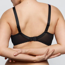 Load image into Gallery viewer, Black bra worn by a person on a plain background
