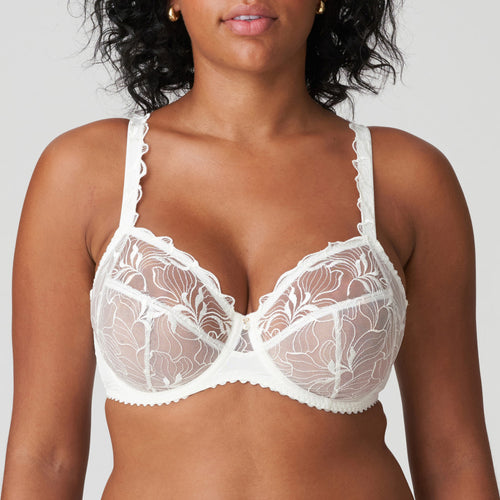 This is a stylish and supportive full cup bra made of a sheer voile, It is decorated with generous, stylised embroidered flowers. Feather-light and airy, with a 3 panelled cup that that firmly lifts and supports the bust. Ivory is an soft white shade that gently contrasts with the skin. Perfect under summer clothes or perfect as bridal lingerie.  Fabric content: Polyamide: 68%, Polyester:18%, Elastane:14%