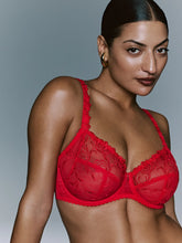 Load image into Gallery viewer, Woman wearing a red bra against a gray background
