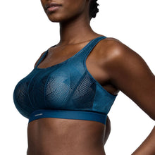 Load image into Gallery viewer, Blue sports bra worn by a model on a white background
