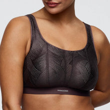 Load image into Gallery viewer, Black patterned sports bra with 'Primadonna' branding on a neutral background
