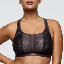 Load image into Gallery viewer, Woman wearing a black sports bra with geometric pattern on a light gray background
