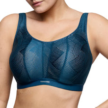 Load image into Gallery viewer, Blue sports bra with geometric pattern on a white background
