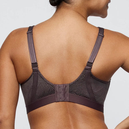 Brown bra worn by a person on a light gray background