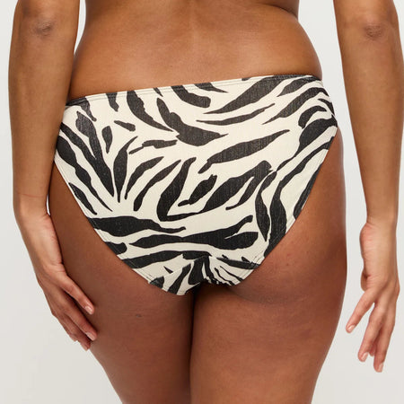 Zebra print bikini bottom on a plain background