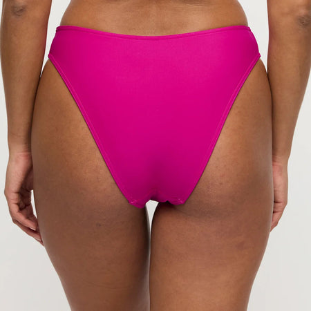Bright pink bikini bottom on a neutral background