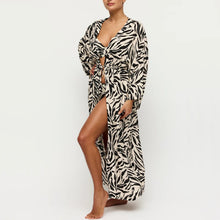 Load image into Gallery viewer, Person wearing a zebra print long dress on a white background
