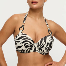 Load image into Gallery viewer, Woman wearing a zebra print bikini top on a plain background
