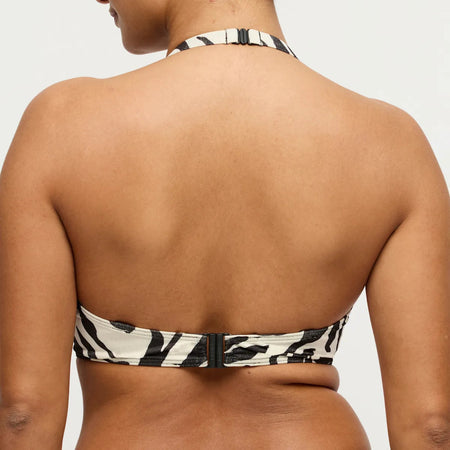 Bikini top with zebra pattern on a plain background