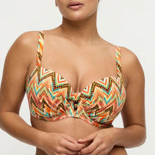 Load image into Gallery viewer, Woman wearing a colorful patterned bikini top on a plain background
