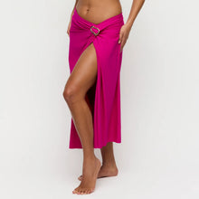 Load image into Gallery viewer, Person wearing a bright pink sarong with a heart-shaped buckle on a white background
