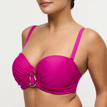 Load image into Gallery viewer, Woman wearing a bright pink bikini top with a gold buckle on a light gray background
