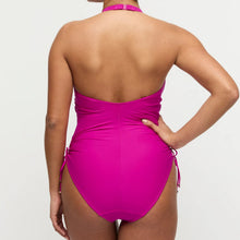 Load image into Gallery viewer, Person wearing a bright pink swimsuit on a light gray background
