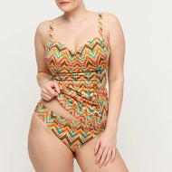 Multicolored zigzag patterned swimsuit on a plain background