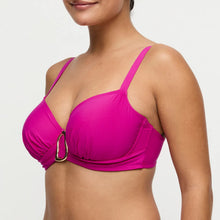 Load image into Gallery viewer, Woman wearing a bright pink bikini top on a white background

