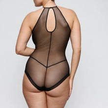 Load image into Gallery viewer, Sheer black bodysuit on a model against a plain background
