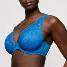 Load image into Gallery viewer, Blue lace bra on a model against a neutral background
