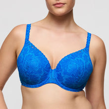 Load image into Gallery viewer, Blue lace bra worn by a model on a plain background
