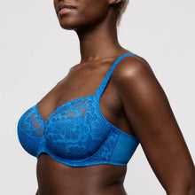 Load image into Gallery viewer, Blue lace bra worn by a model on a plain background
