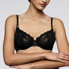 Load image into Gallery viewer, Black lace bra worn by a model on a plain background
