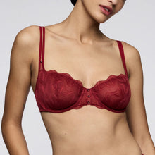 Load image into Gallery viewer, Red lace bra worn by a model on a plain background
