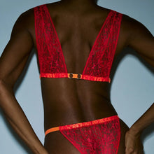 Load image into Gallery viewer, Red lace lingerie set on a model against a light blue background
