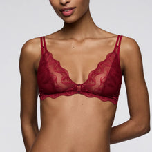 Load image into Gallery viewer, Red lace bra worn by a model on a plain background
