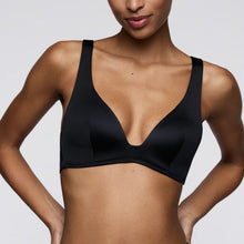 Load image into Gallery viewer, Black bra worn by a model on a plain background
