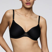 Load image into Gallery viewer, Black bra worn by a model on a plain background
