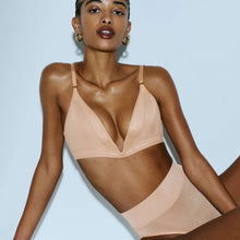 Load image into Gallery viewer, Woman wearing a beige bikini against a light blue background
