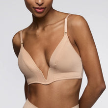 Load image into Gallery viewer, Beige bra worn by a model on a plain background
