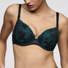 Load image into Gallery viewer, Black lace bra worn by a model on a plain background
