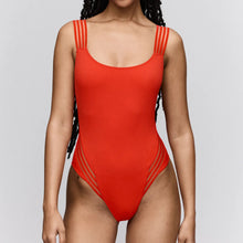 Load image into Gallery viewer, Red swimsuit worn by a model on a light gray background
