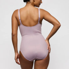 Load image into Gallery viewer, Woman wearing a light purple swimsuit against a plain background
