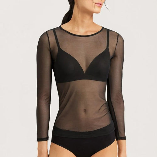 Woman wearing a black sheer long-sleeve top with a round neck. The Finishes are simple in the same material.
The bottom reaches the hip.